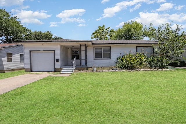 single story home featuring a garage and a front yard