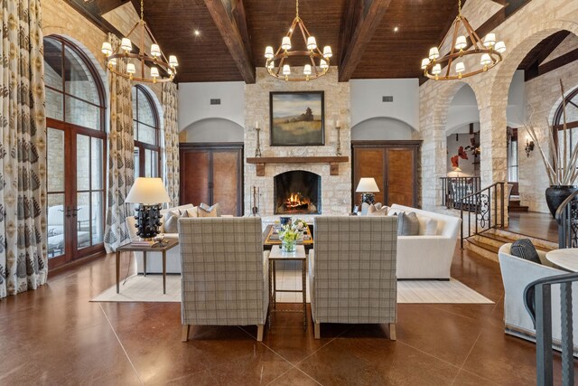 tiled living room with beamed ceiling, wood ceiling, high vaulted ceiling, and plenty of natural light