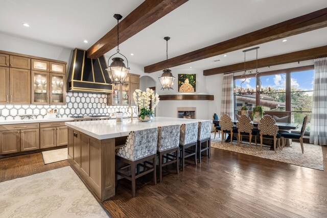 dining room featuring beamed ceiling, a notable chandelier, and light wood-type flooring