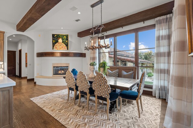 carpeted bedroom featuring ceiling fan, vaulted ceiling, and a fireplace