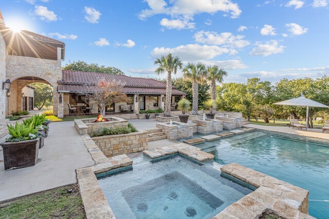 view of swimming pool featuring a patio area and pool water feature