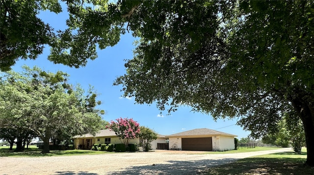 ranch-style house featuring a garage