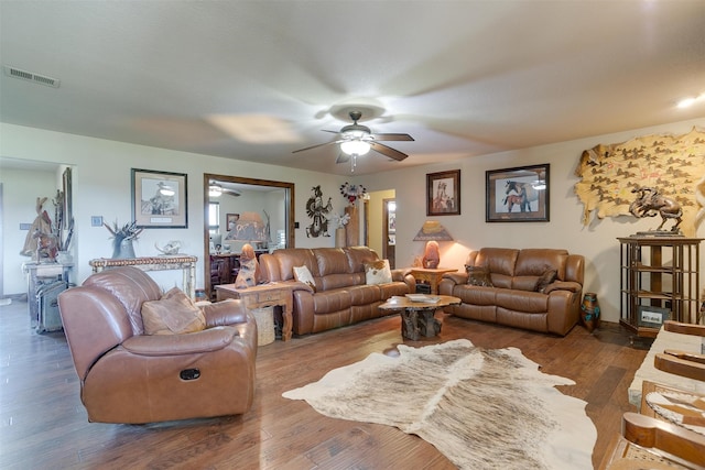 living room featuring dark hardwood / wood-style flooring and ceiling fan