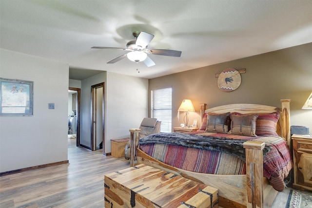 bedroom with light wood-type flooring and ceiling fan