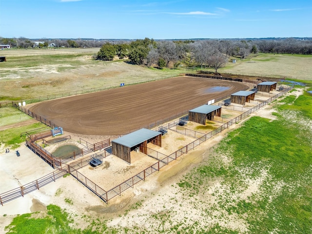 birds eye view of property with a rural view