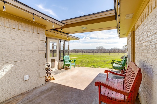 view of patio with a rural view