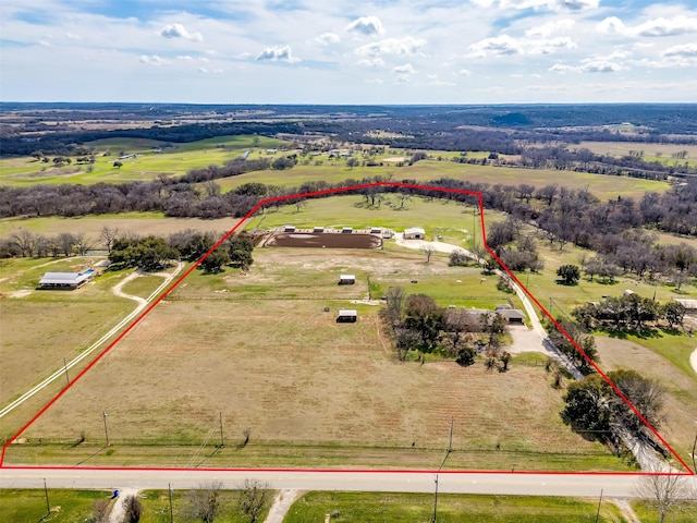 birds eye view of property featuring a rural view