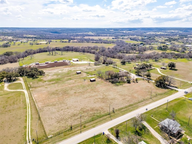 birds eye view of property with a rural view