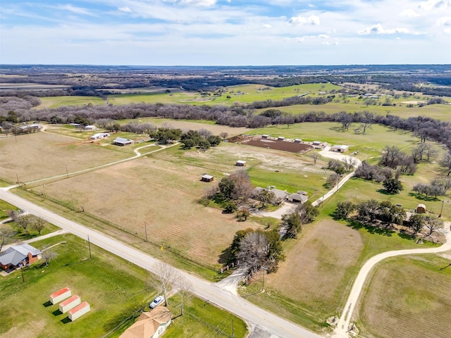 birds eye view of property with a rural view