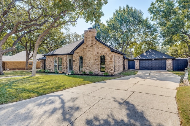 view of front facade featuring a front lawn and a garage