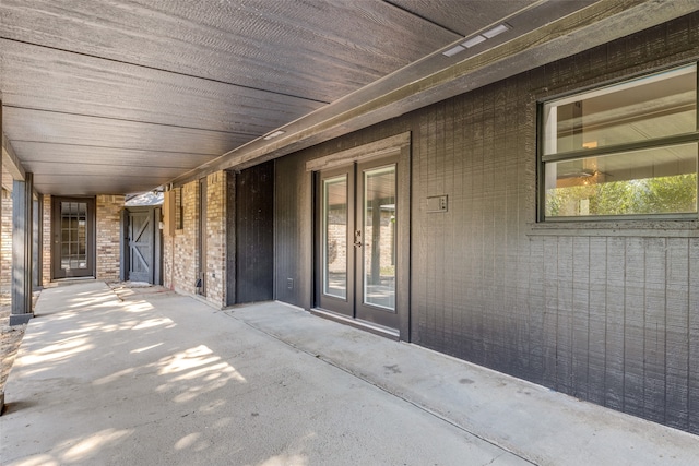 property entrance featuring french doors and a patio