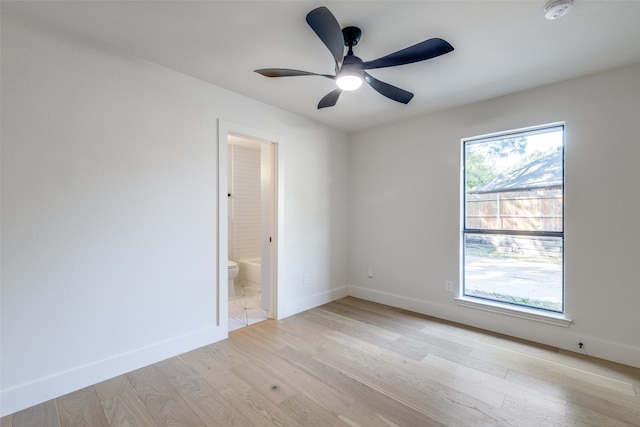 spare room featuring light hardwood / wood-style floors and ceiling fan