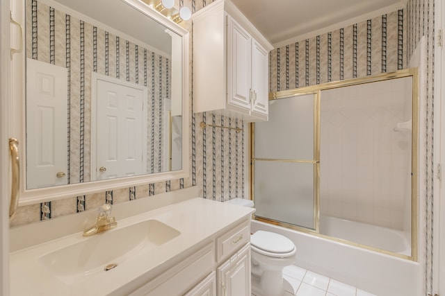 full bathroom with shower / bath combination with glass door, tile patterned flooring, vanity, and toilet