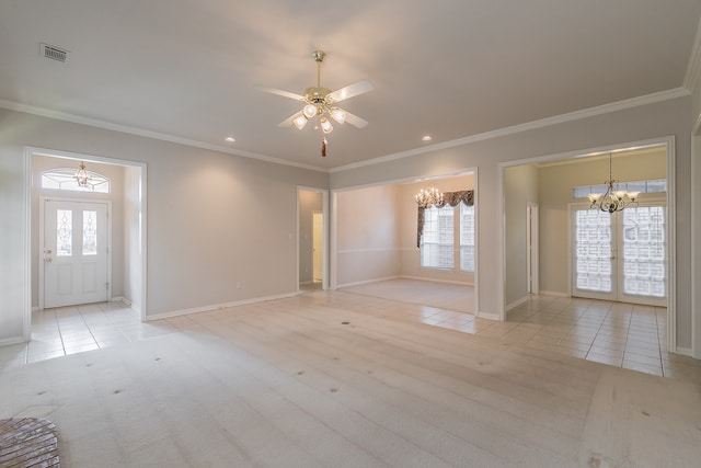 unfurnished room with french doors, light tile patterned floors, ceiling fan with notable chandelier, and ornamental molding