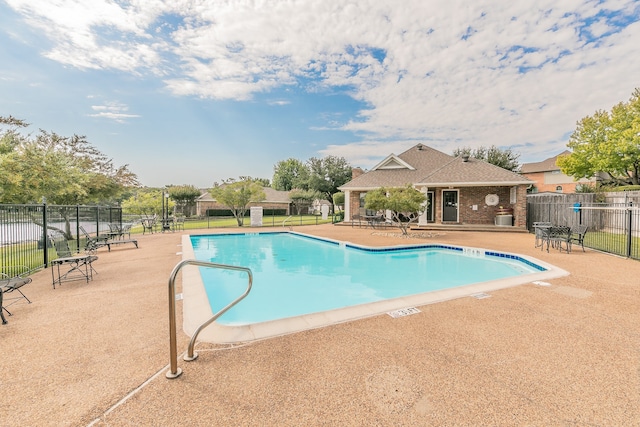 view of swimming pool featuring a patio area