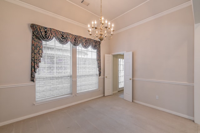 carpeted spare room featuring an inviting chandelier and ornamental molding