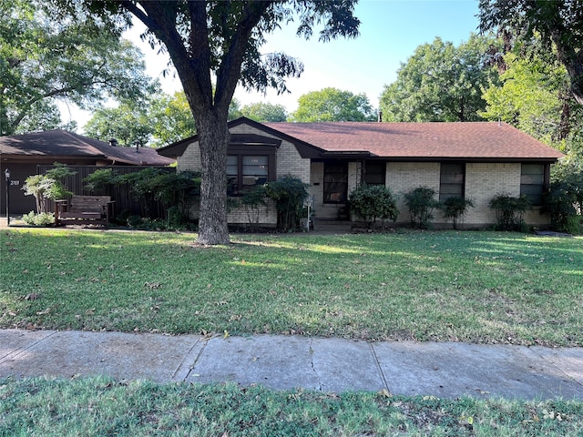 ranch-style home with a front lawn