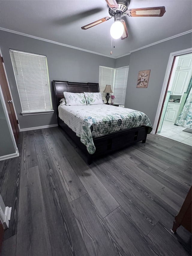 bedroom featuring dark wood-type flooring, ceiling fan, connected bathroom, and ornamental molding