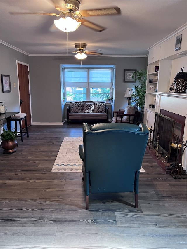 living room with dark wood-type flooring, crown molding, and ceiling fan