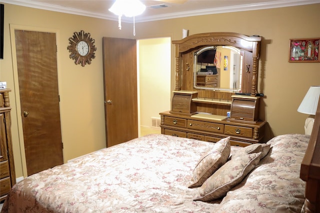 bedroom with ornamental molding and ceiling fan