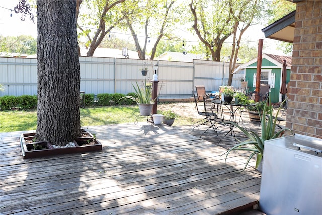 wooden deck with a shed