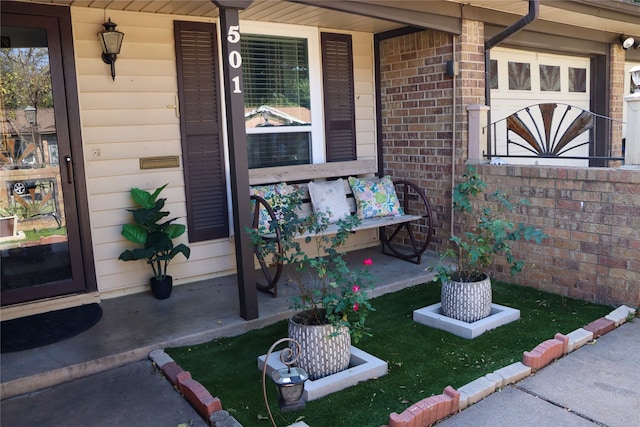 property entrance featuring covered porch