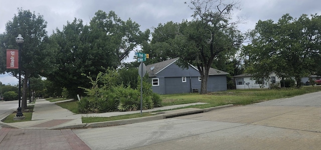 view of side of property featuring a yard