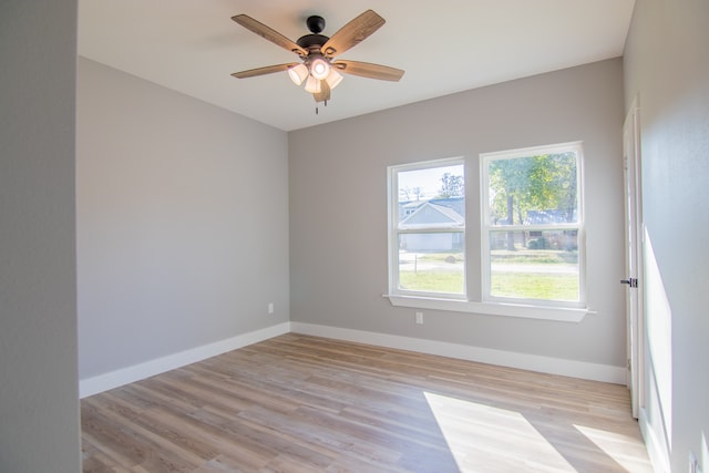 spare room featuring ceiling fan and light hardwood / wood-style floors