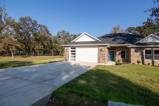 ranch-style house with a garage and a front yard