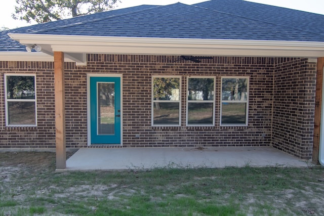 entrance to property with a patio