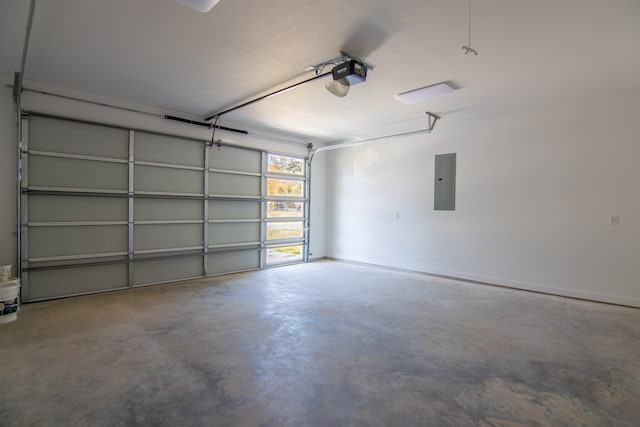 garage featuring electric panel and a garage door opener