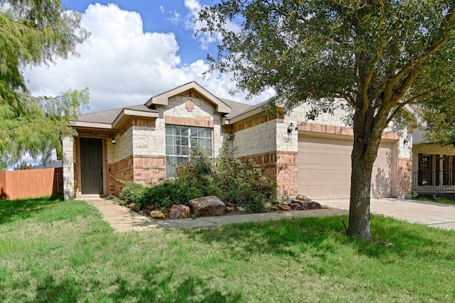 view of front of home with a front yard and a garage