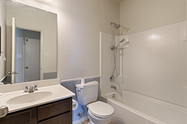 full bathroom with vanity, toilet, and tiled shower / bath combo