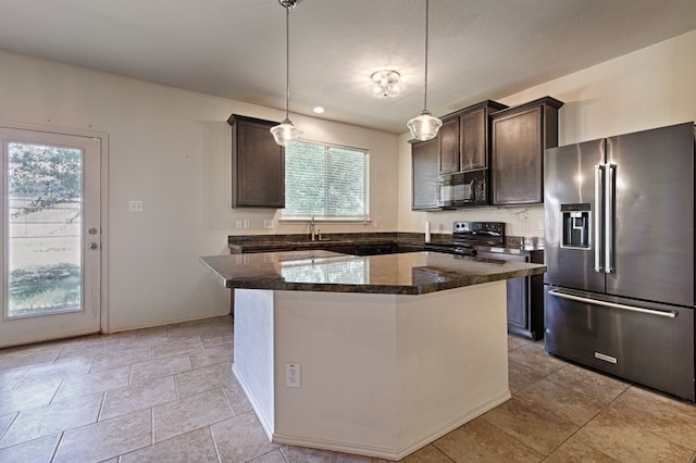 kitchen with black appliances, a center island, hanging light fixtures, and plenty of natural light