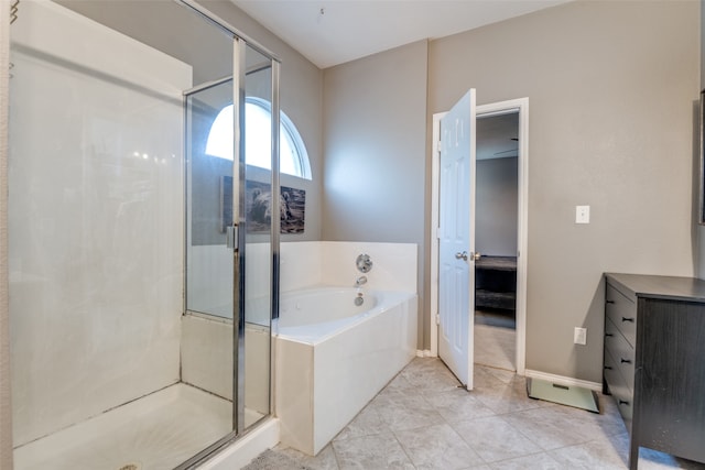 bathroom with tile patterned floors and separate shower and tub