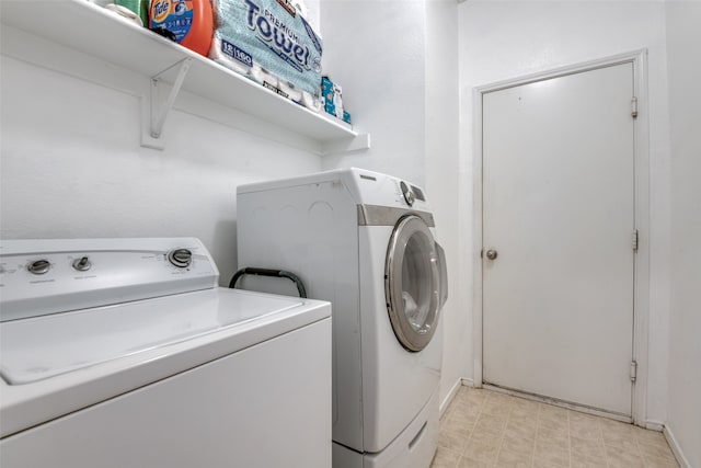 clothes washing area featuring washing machine and dryer