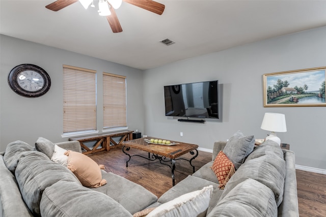 living room featuring ceiling fan and hardwood / wood-style flooring