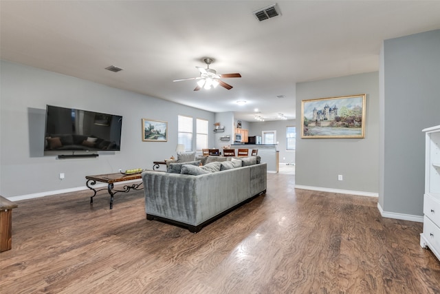 living room with hardwood / wood-style flooring and ceiling fan