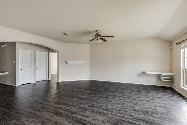 unfurnished living room featuring ceiling fan, dark hardwood / wood-style floors, and vaulted ceiling