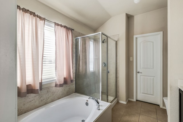 bathroom with a healthy amount of sunlight, tile patterned flooring, lofted ceiling, and independent shower and bath