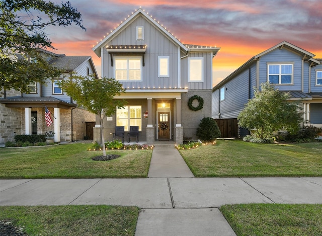 view of front of home with a lawn