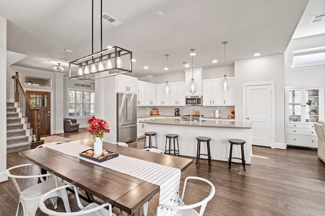 dining room with dark hardwood / wood-style flooring