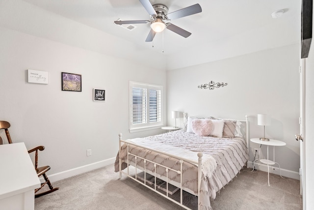 bedroom with ceiling fan and light colored carpet