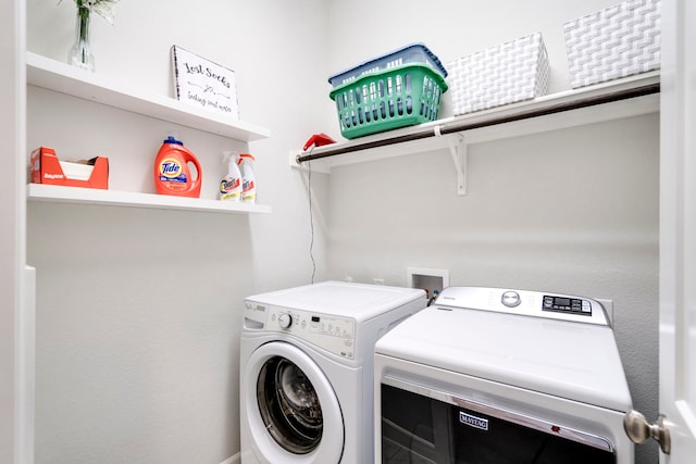 washroom with washer and clothes dryer