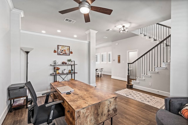 home office featuring ornamental molding, ornate columns, ceiling fan, and dark wood-type flooring