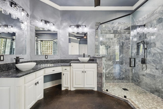 bathroom featuring vanity, a shower with shower door, and ornamental molding