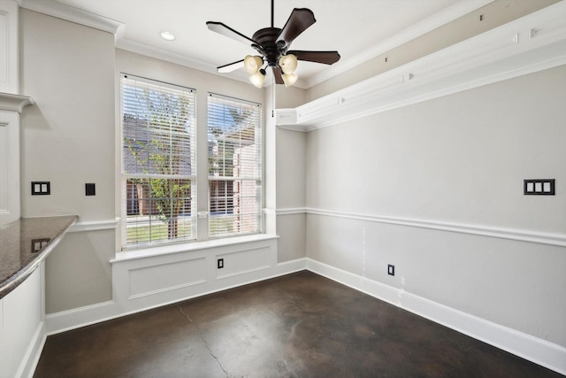 unfurnished dining area with ceiling fan and crown molding