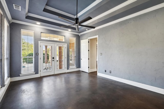 empty room with french doors, a raised ceiling, ceiling fan, and ornamental molding