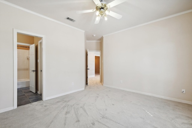 unfurnished room with carpet, ceiling fan, and crown molding