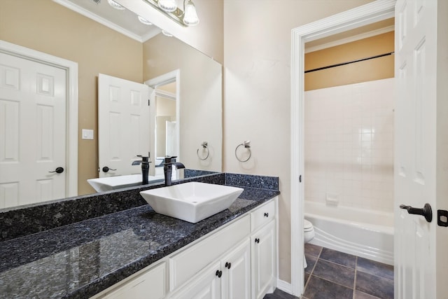 full bathroom with tile patterned floors, ornamental molding, vanity, toilet, and tiled shower / bath